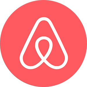 Das Bild zeigt das Airbnb-Logo, das eine stilisierte „A“-Form mit einer durchgehenden weißen Linie auf einem roten, kreisförmigen Hintergrund aufweist. Das Design ist schlicht und modern, spiegelt die Markenidentität des Unternehmens wider und ist eine ideale Empfehlung für die Präsentation minimalistischer Eleganz.